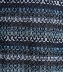 Lange jurk in petrolblauw met lange mouwen en haakwerk