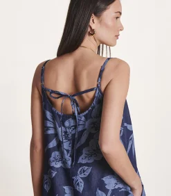 Ruimvallende blauwe jumpsuit met bloemenprint en bandjes